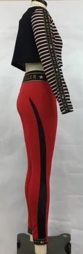 Activewear sample: red leggings with black mesh side panels and a striped crop top, seen from the back